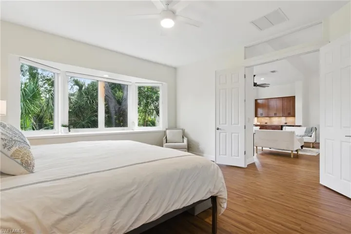The french doors to the primary suite are located just off the living room area
