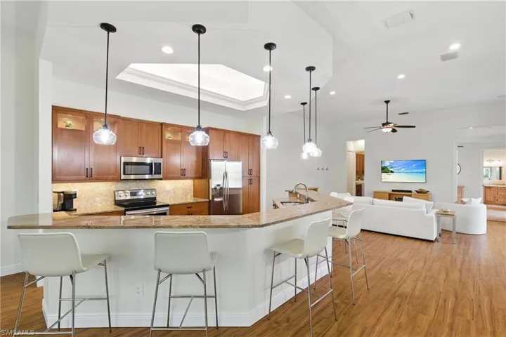 Plenty of seating at the island in the kitchen to entertain