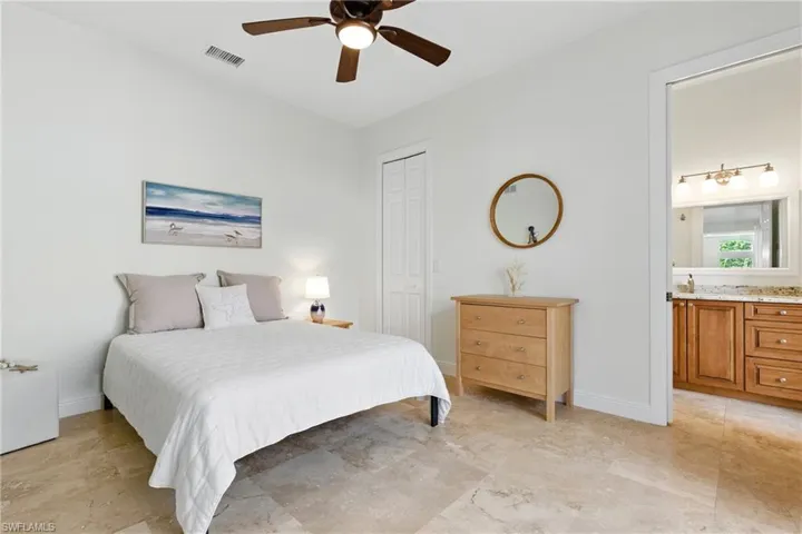 The second bedroom suite is located off the family room and features a walk in closet and private bathroom