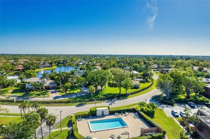 Aerial perspective of suburban area with a pool