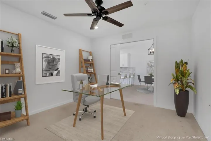 Den located off living room / virtually staged
