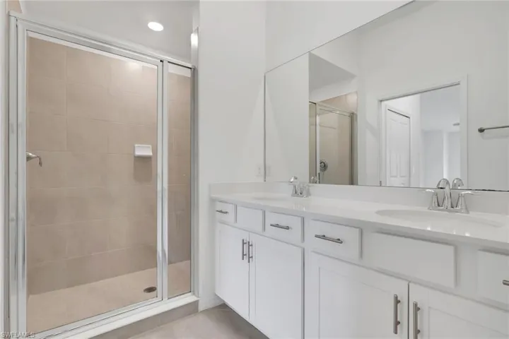 Main Bathroom with dual sinks, quartz counter top