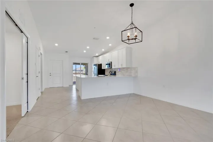 Dining area, living room and entry to den area