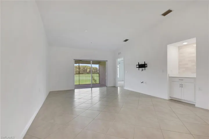 Living room with built-in tiled coffee bar