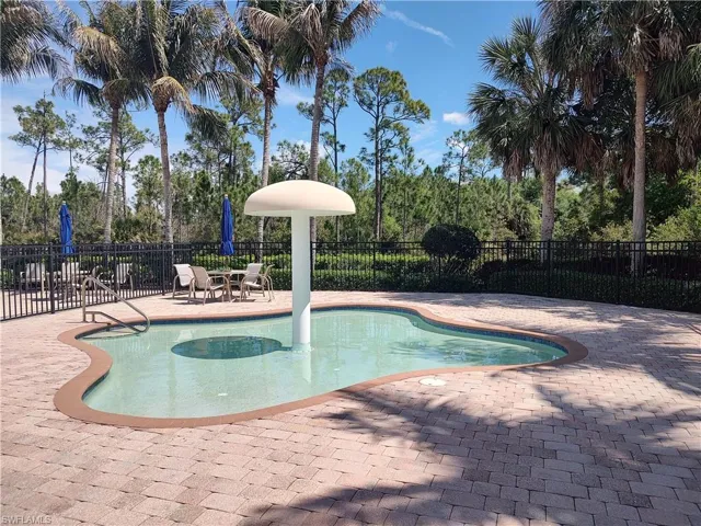 View of swimming pool featuring patio surround