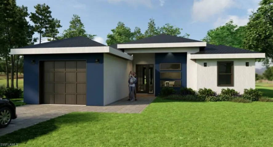 View of front of house featuring a garage and a front yard