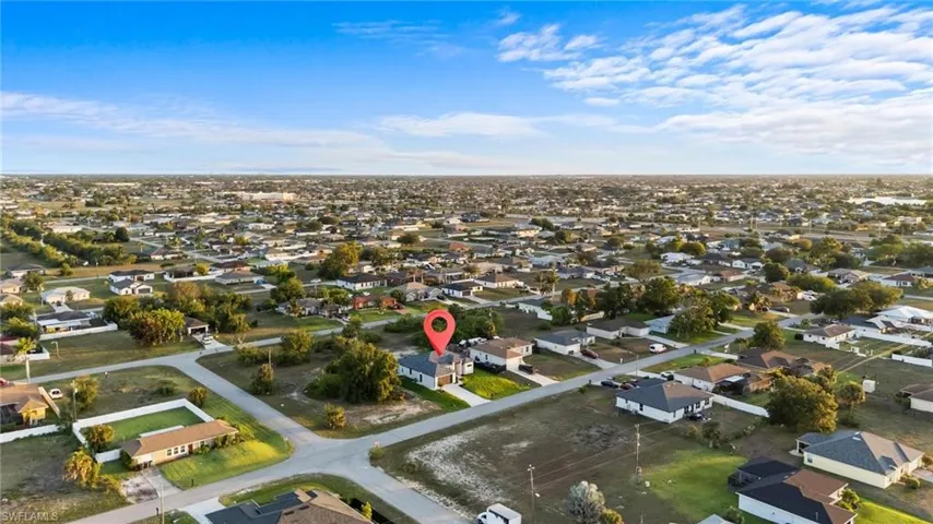 Aerial overview of property's location with nearby suburban area