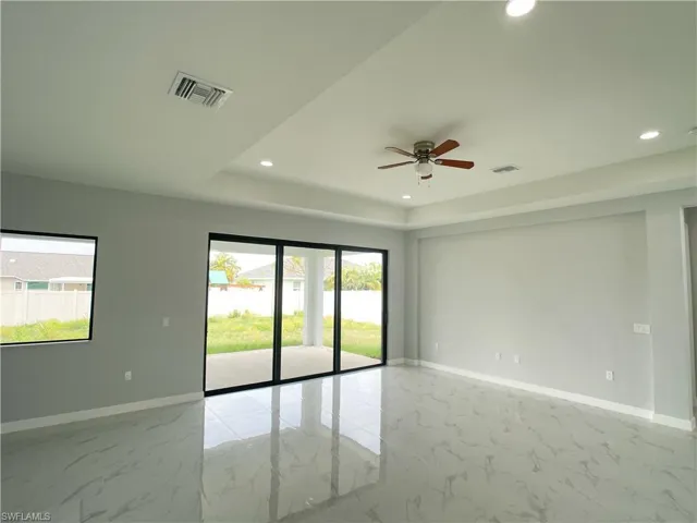 Empty room featuring visible vents, baseboards, and marble finish floor