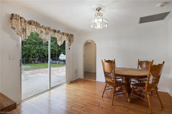 Dining space featuring light hardwood / wood-style floors and a chandelier