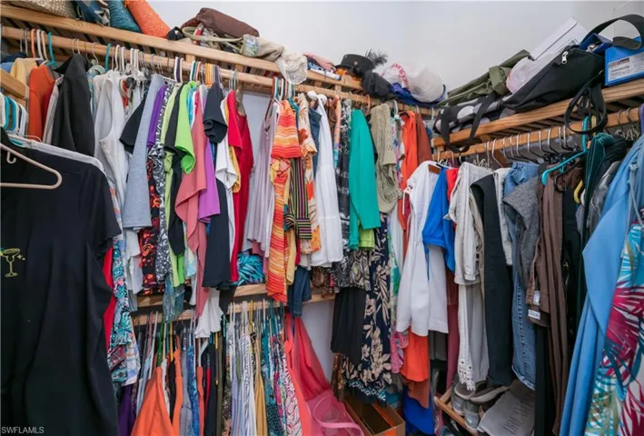 His/Hers walk in closets with upgraded shelving offers plenty of room for clothes and storage