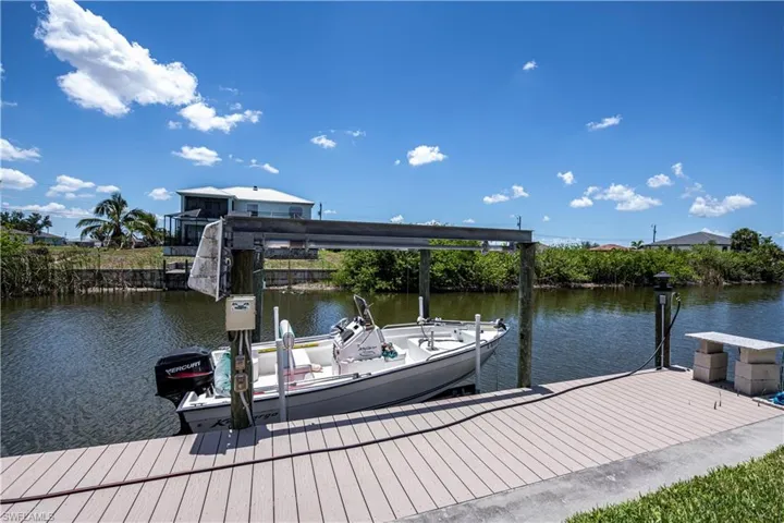 Dock featuring water and electric and a 4,000 lb boat lift