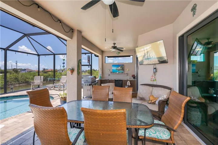 Live the Florida lifestyle under your massive lanai with pool and water views