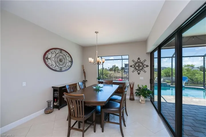 Dining room off kitchen-open sliders for indoor/outdoor eating and entertaining