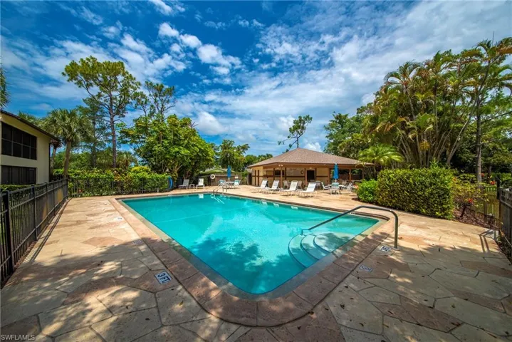 Swimming pool featuring integrated steps and handrails