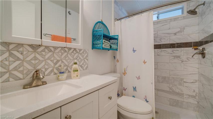 Another porcelain walk-in shower! A new high-rise toilet. O course, th plumbing has been redone.