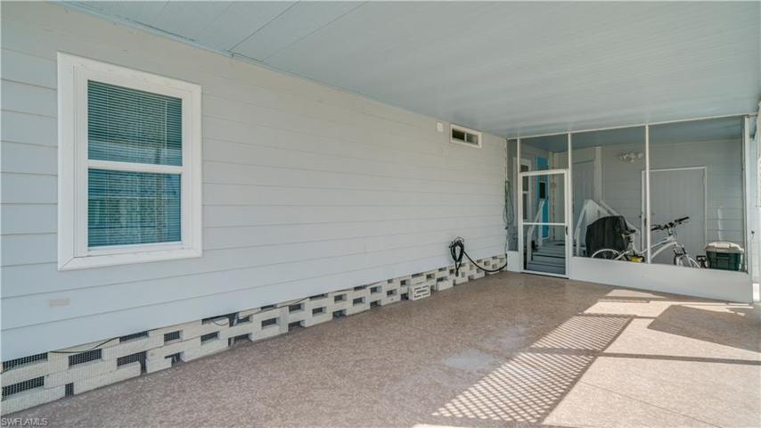 The large carport easily accommodates two cars. Take a good look at the block. The critter control barrier is all around this well maintained home.