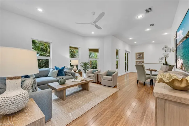 Living area featuring recessed lighting, light wood finished floors, and visible vents