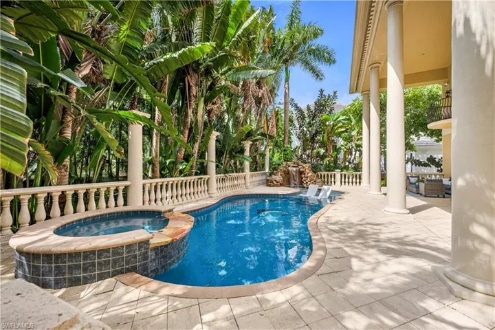 View of pool featuring a pool with connected hot tub and a patio