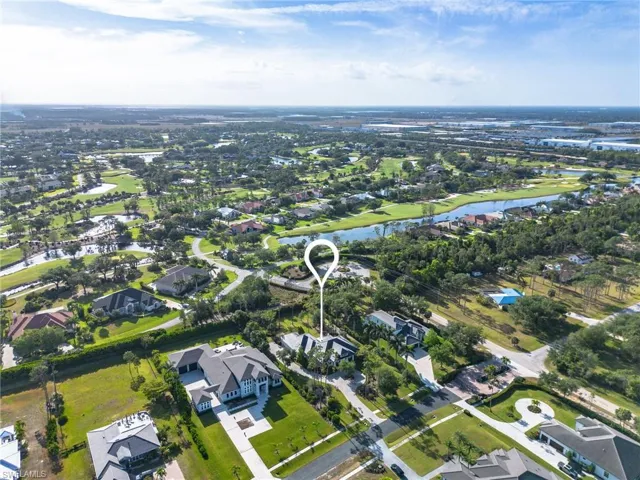 Drone / aerial view with a residential view and a water view