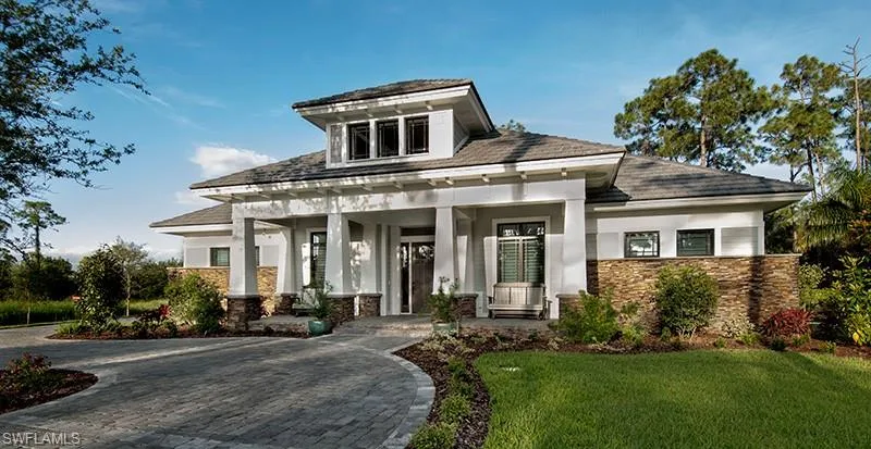 View of front of house featuring a front yard and a porch