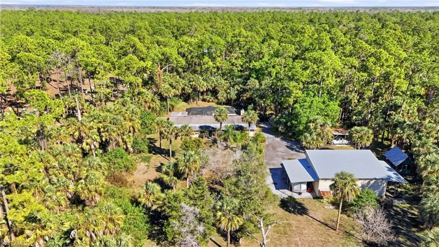 View from above of property with a heavily wooded area