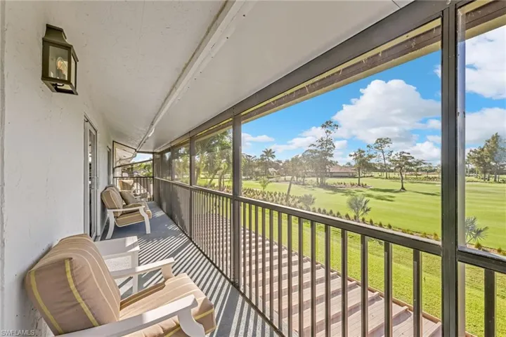 Sunroom / solarium featuring a balcony and golf course view
