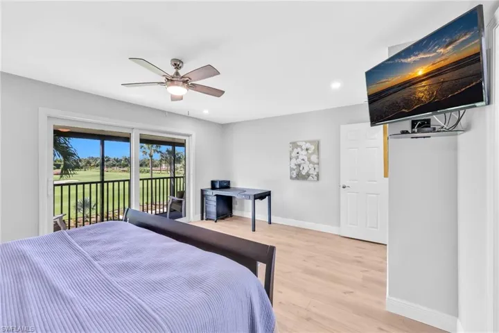 Bedroom with access to exterior, light wood-type flooring, recessed lighting, and ceiling fan
