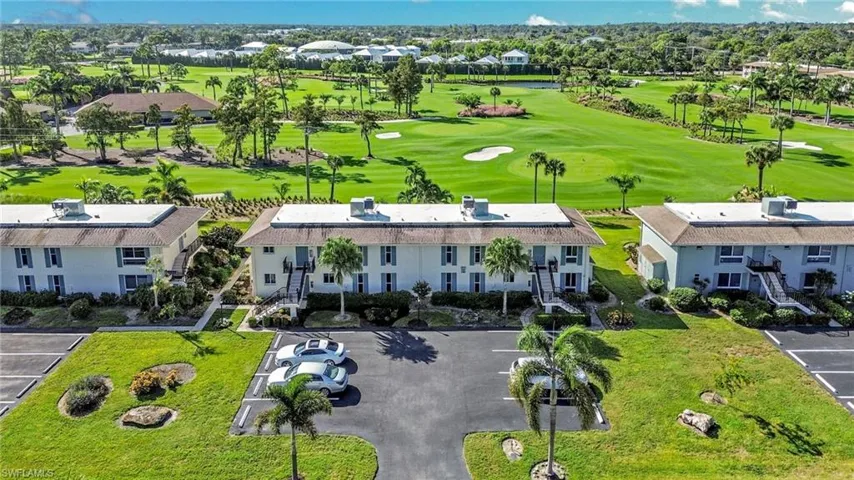 Bird's eye view of a golf course and a large body of water