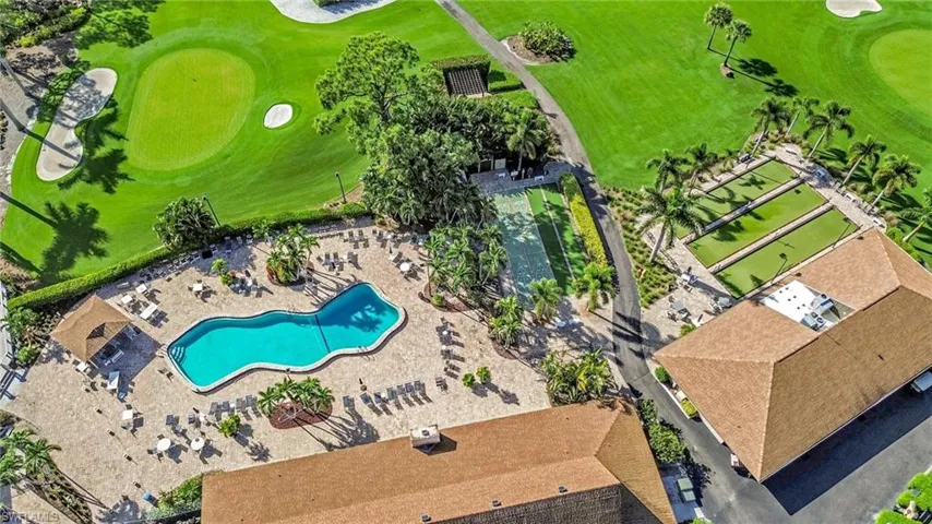 Drone / aerial view of a local golf course and a pool