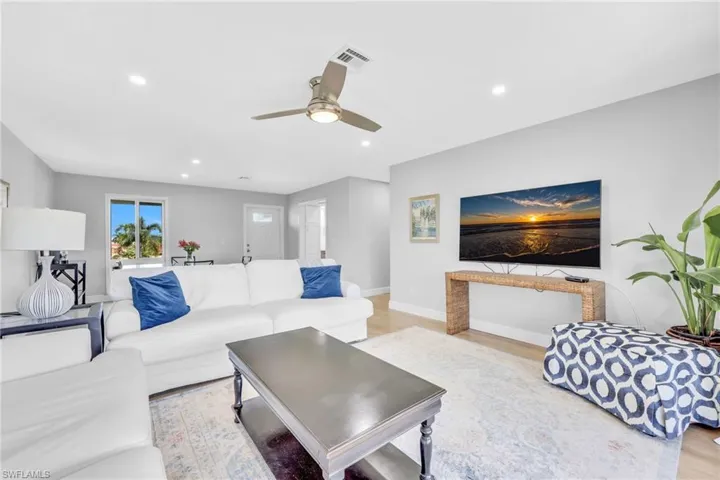 Living area featuring light wood-type flooring, recessed lighting, and ceiling fan