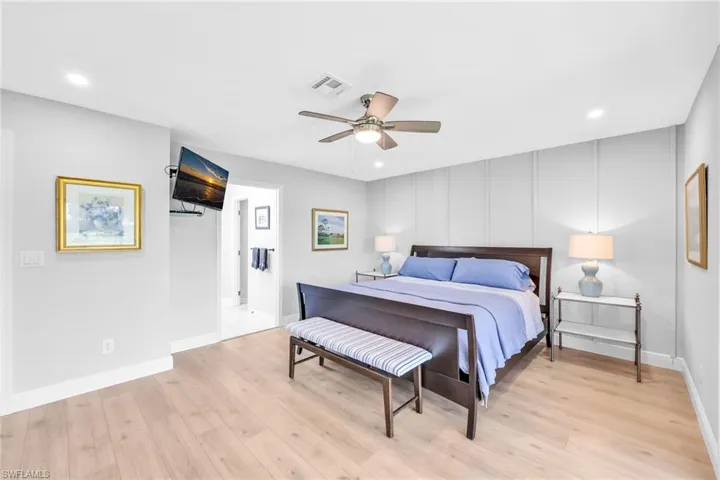 Bedroom with recessed lighting, a ceiling fan, and light wood finished floors