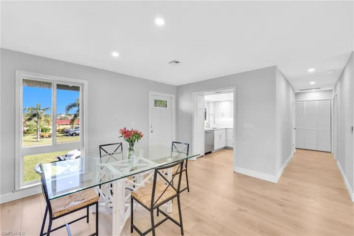 Dining area featuring recessed lighting and light wood-style flooring