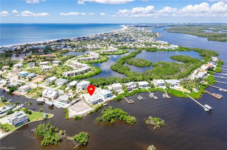 Aerial perspective of suburban area with a nearby body of water