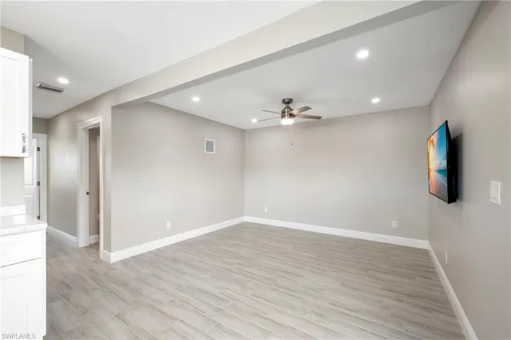 Unfurnished room with recessed lighting, a ceiling fan, and wood finish floors