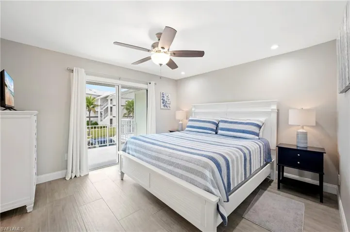 Bedroom with access to outside, recessed lighting, a ceiling fan, and light wood-style floors