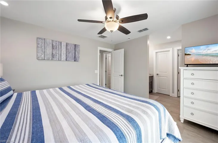 Bedroom featuring recessed lighting, light wood-style flooring, and a ceiling fan