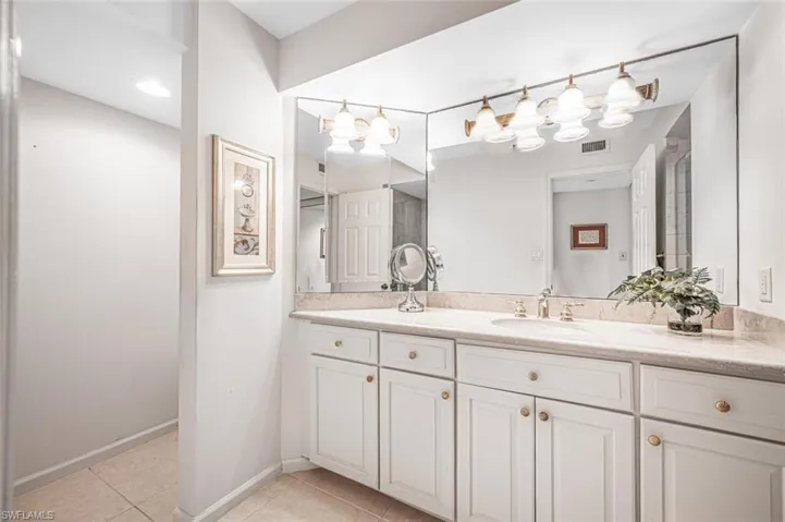 Marble guest bath with walk-in shower also.