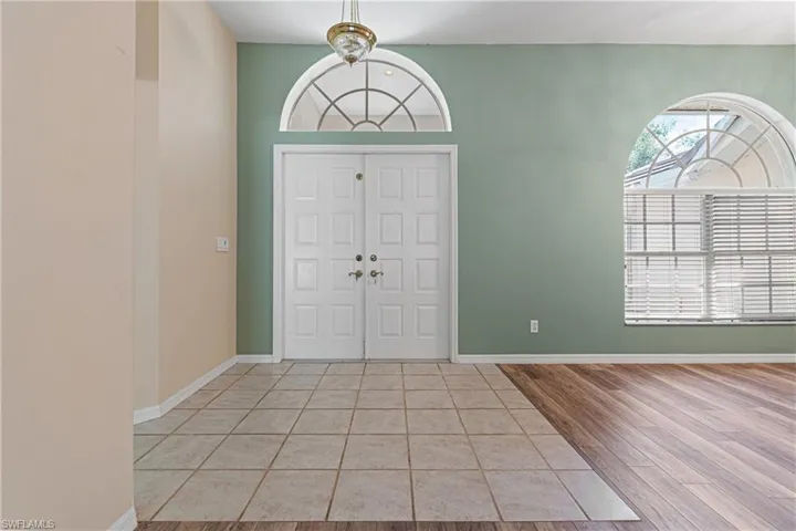 Foyer entrance featuring new light hardwood / wood-style flooring