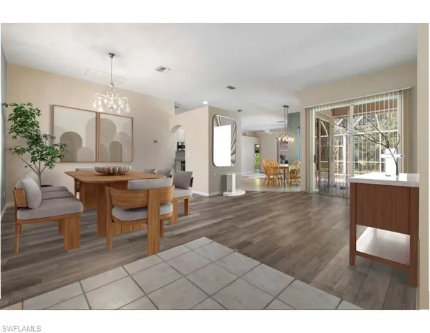 Virtually staged Formal Dining/ Living room with a chandelier and light new wood-type flooring