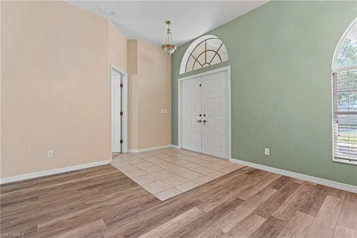 Entrance foyer featuring new light hardwood / wood-style floors