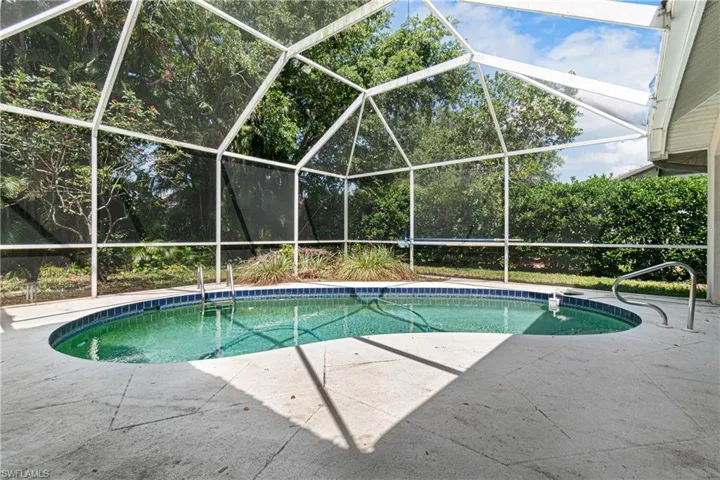 View of swimming pool with a patio area and a lanai