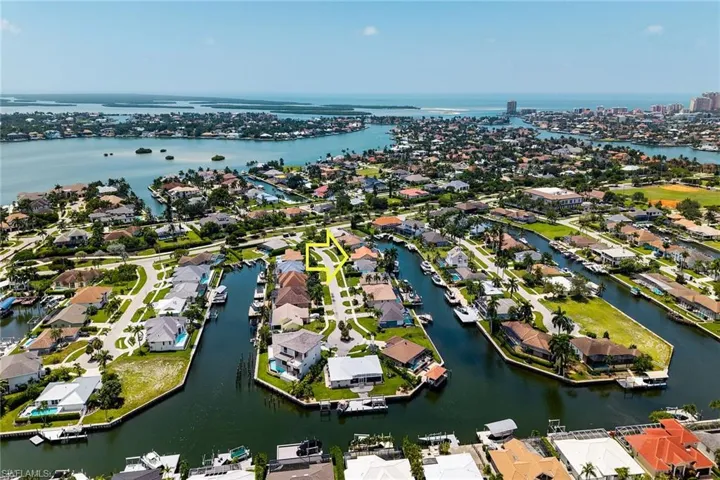 Waterfront property with direct Gulf access, surrounded by canals and residential development
