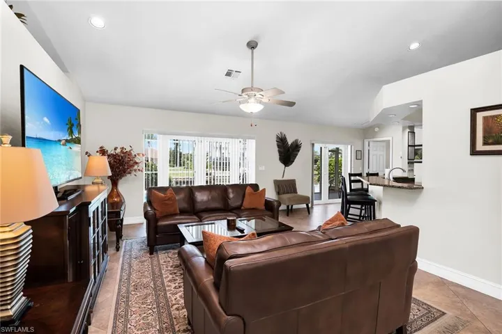 Recessed lighting, ceiling fan, and tiled flooring