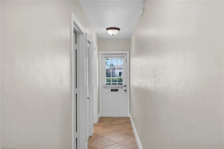 Hallway looking at rear Door to Pool Area