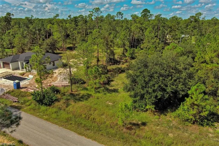 View from above of property featuring a forest