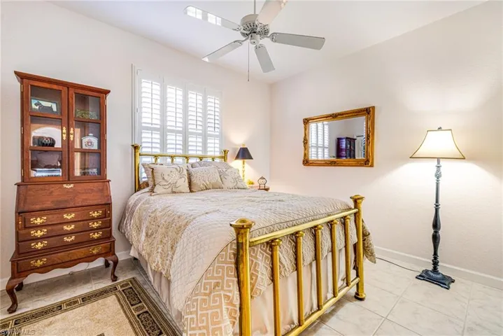 Bedroom with baseboards and a ceiling fan