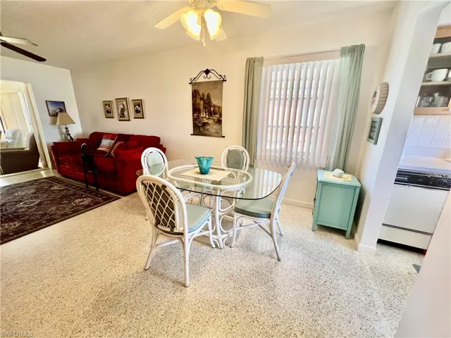 Dining area featuring terrazzo floors.