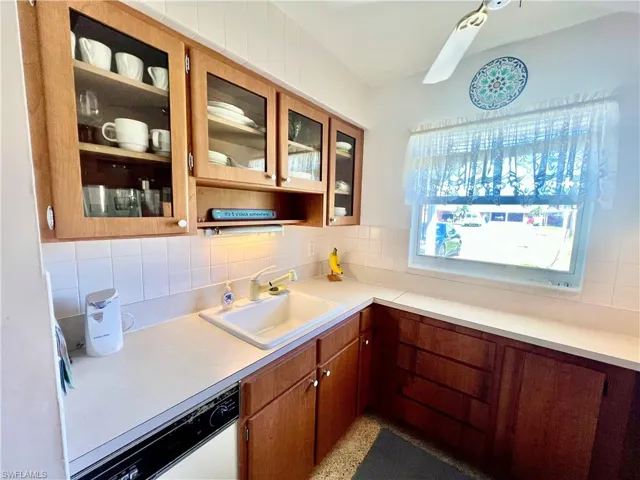 Kitchen featuring tasteful backsplash,  countertops and a sink