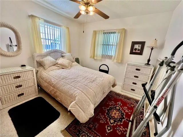 Guest bedroom with terrazzo floors.