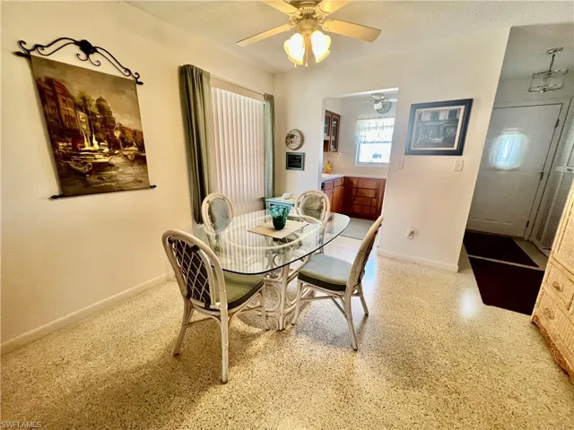Dining area featuring terrazzo floors.